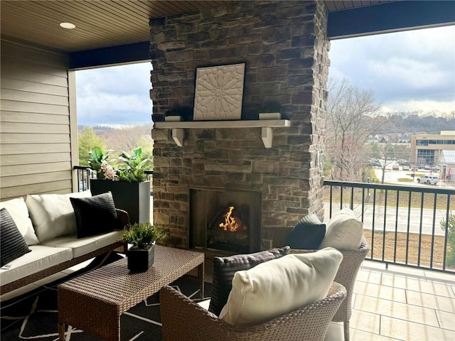 exterior space featuring an outdoor living space with a fireplace