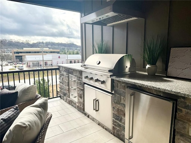 view of patio / terrace featuring area for grilling and exterior kitchen