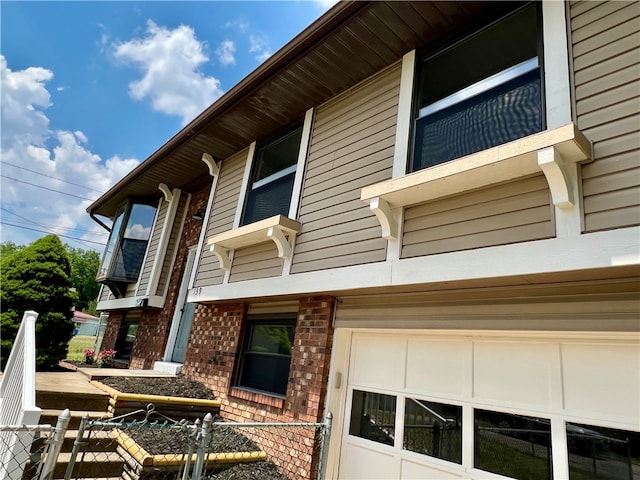 view of side of property with a garage