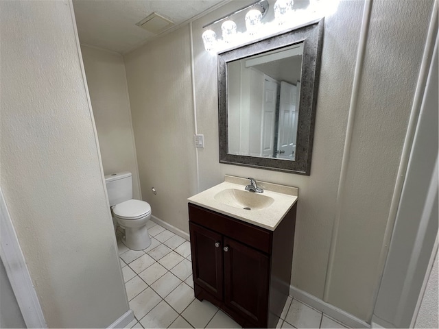 bathroom featuring tile patterned floors, toilet, and vanity