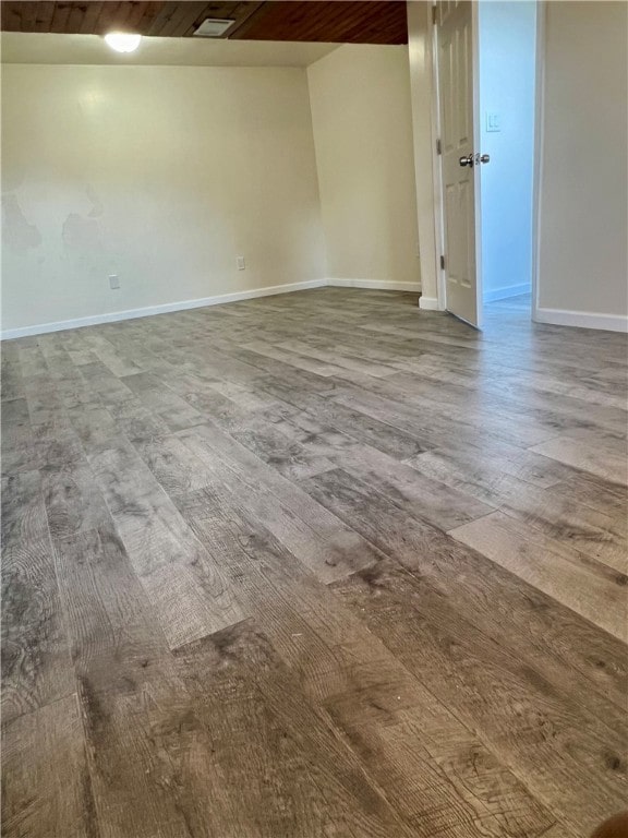 spare room with wood ceiling and hardwood / wood-style floors