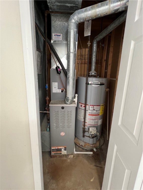 utility room featuring gas water heater