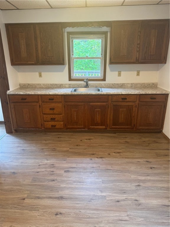 kitchen featuring sink and light wood-type flooring