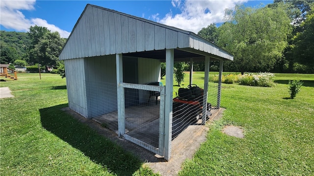 view of outbuilding with a lawn