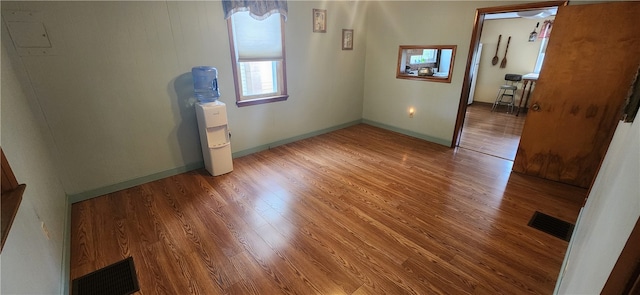 spare room featuring hardwood / wood-style floors