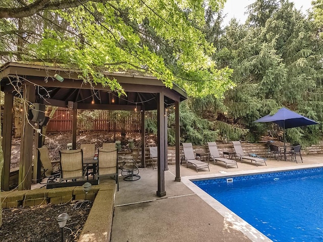 view of pool with a gazebo and a patio area