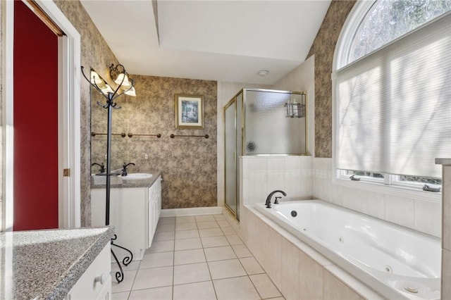 bathroom featuring tile patterned flooring, vanity, and separate shower and tub