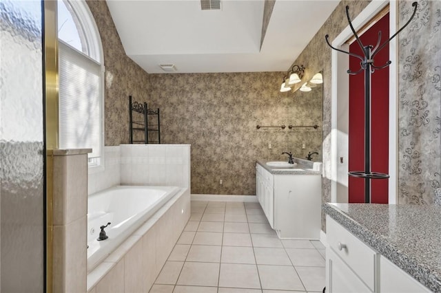 bathroom featuring tile patterned flooring, vanity, and plus walk in shower