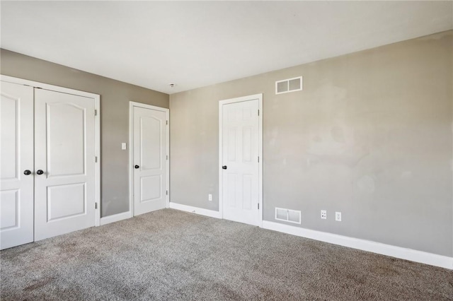 unfurnished bedroom with carpet