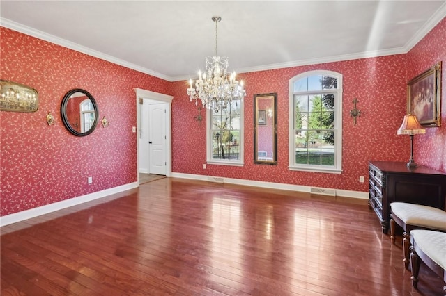 interior space featuring ornamental molding, dark wood-type flooring, and a chandelier