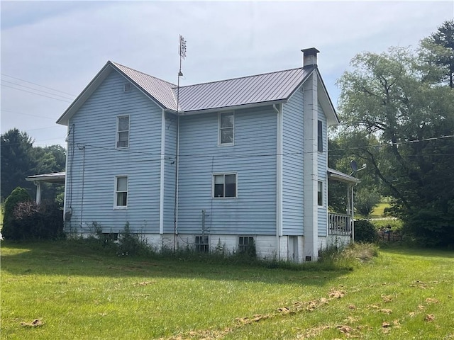 2612 Canoe Ridge Rd, Canoe/Banks Twps, PA 15772 - view of home's exterior featuring a lawn, metal roof, and a chimney