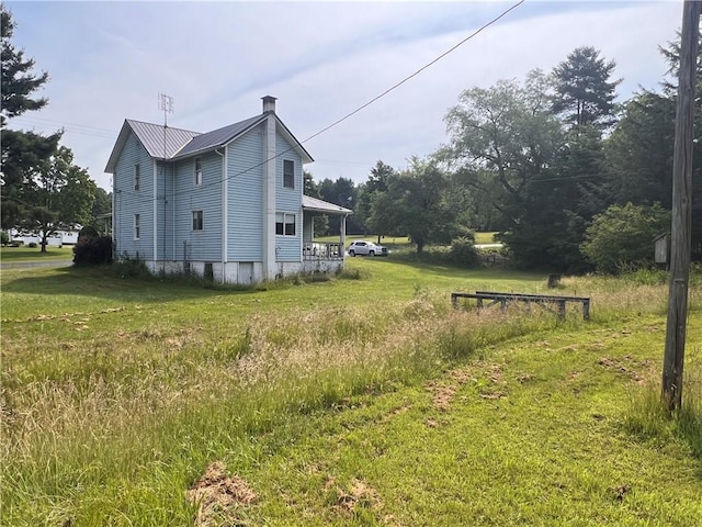 2612 Canoe Ridge Rd, Canoe/Banks Twps, PA 15772 - view of property exterior with metal roof and a chimney