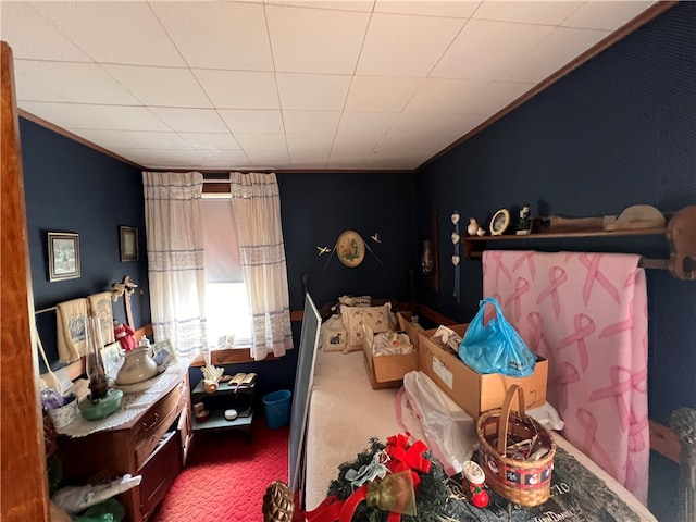 carpeted bedroom featuring crown molding