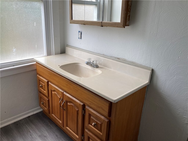 bathroom featuring vanity and hardwood / wood-style flooring