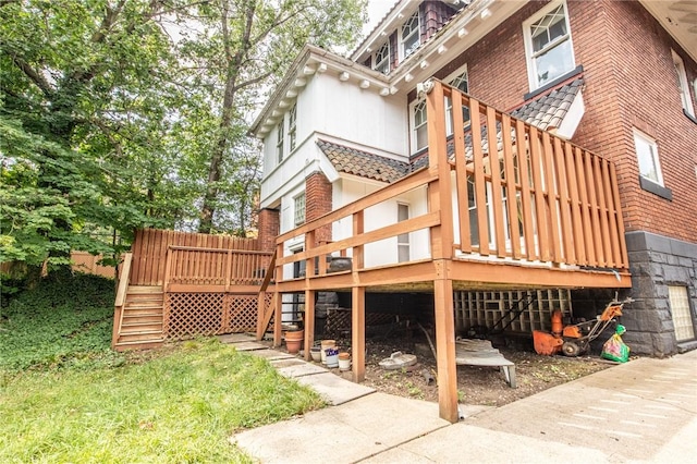 rear view of property featuring a deck