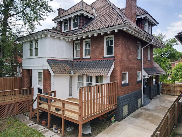 rear view of property with a deck