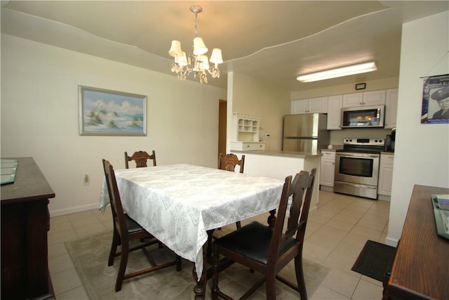 dining room with a chandelier and light tile patterned floors