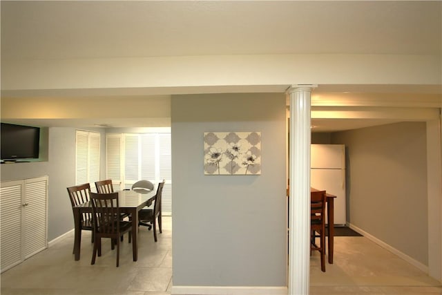 dining space with ornate columns