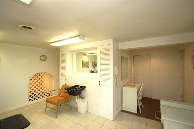 interior space with light tile patterned floors