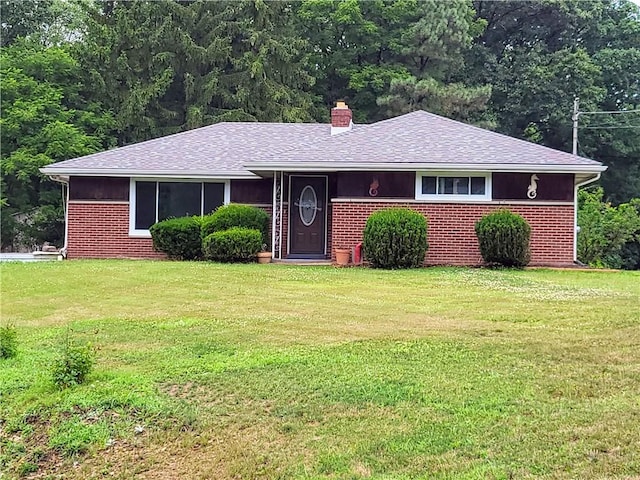 ranch-style home with a front lawn