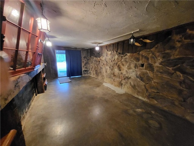 basement featuring a textured ceiling