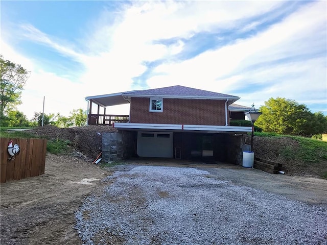 back of house with a garage