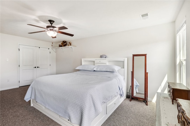 bedroom with carpet, a closet, and ceiling fan