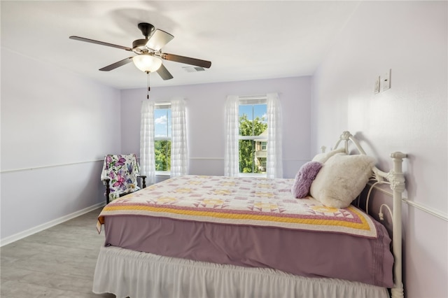 bedroom with wood-type flooring and ceiling fan