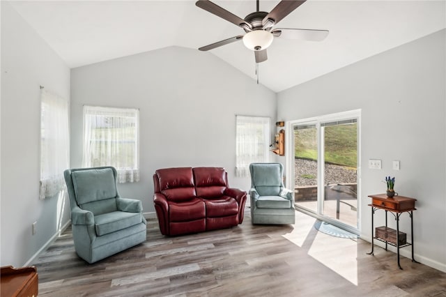 sitting room featuring hardwood / wood-style flooring, high vaulted ceiling, and ceiling fan