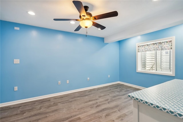 interior space featuring ceiling fan and hardwood / wood-style flooring