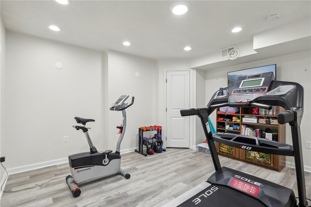 exercise room featuring light hardwood / wood-style flooring