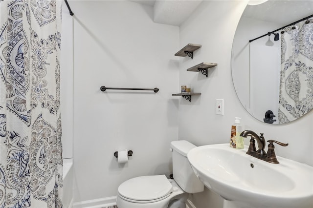 full bathroom with sink, toilet, and shower / bath combination with curtain