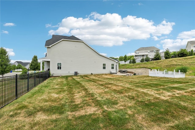 back of house with a lawn