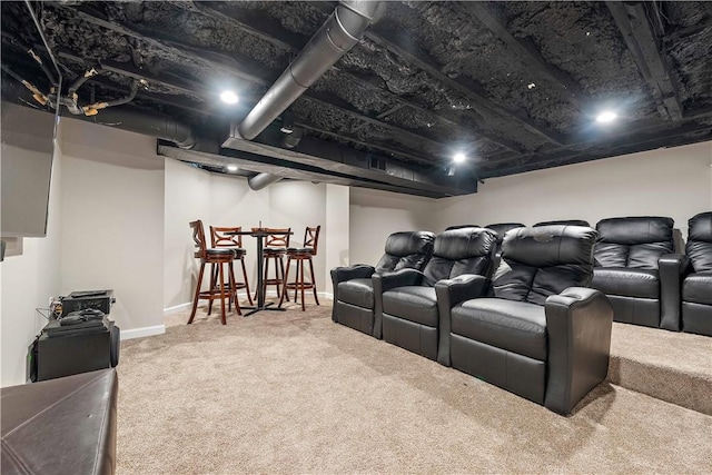 home theater with bar and carpet flooring