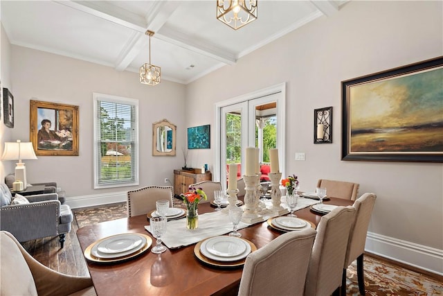 dining room with french doors, a wealth of natural light, beam ceiling, and coffered ceiling