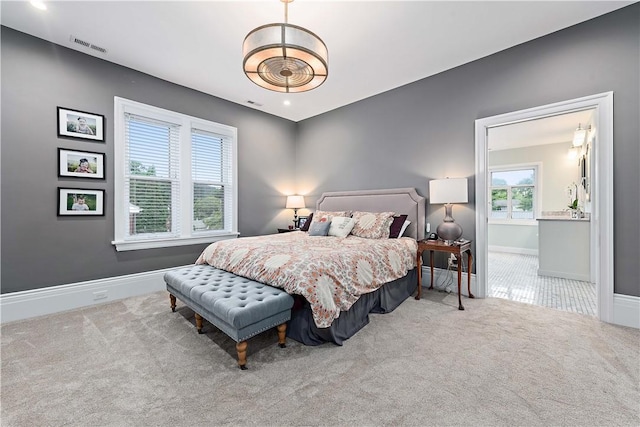 bedroom featuring light carpet