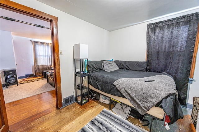 bedroom featuring hardwood / wood-style flooring