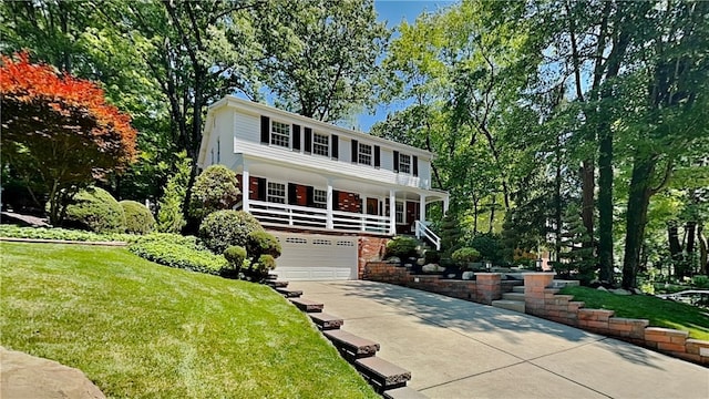 view of front of home with a garage and a front yard