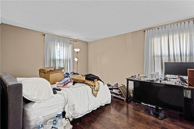 bedroom with hardwood / wood-style flooring