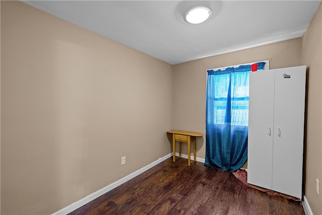 unfurnished room featuring wood-type flooring