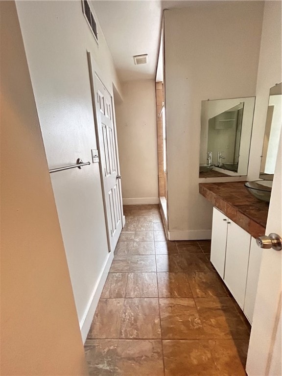 corridor with tile patterned flooring