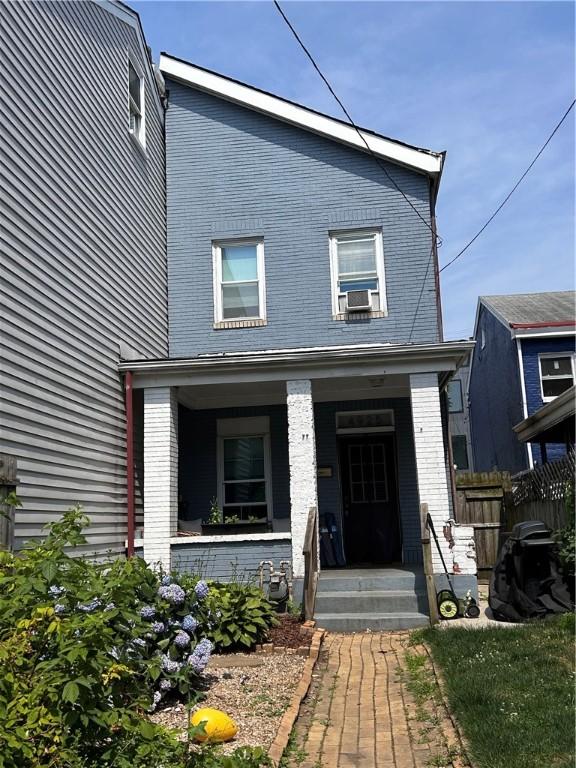 view of front of house featuring cooling unit