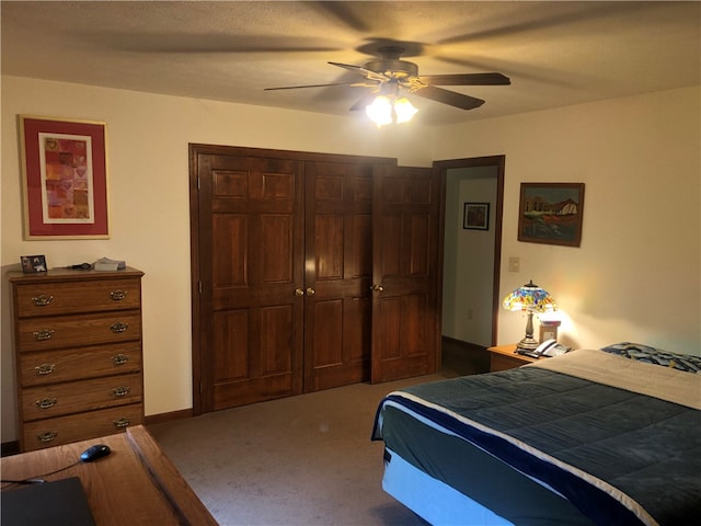 bedroom with a closet, carpet floors, and ceiling fan