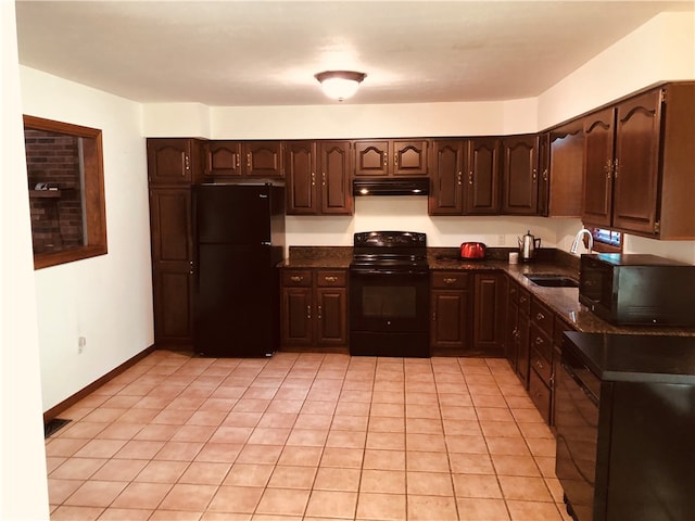 kitchen with sink, light tile patterned flooring, black appliances, and dark brown cabinets