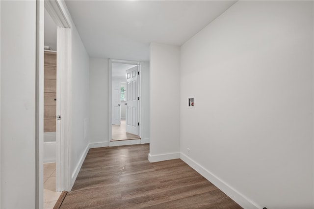 corridor with dark hardwood / wood-style flooring