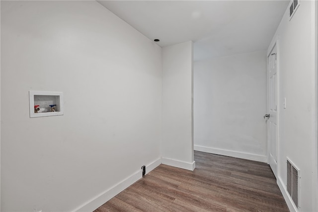 washroom featuring hookup for a washing machine and dark hardwood / wood-style floors