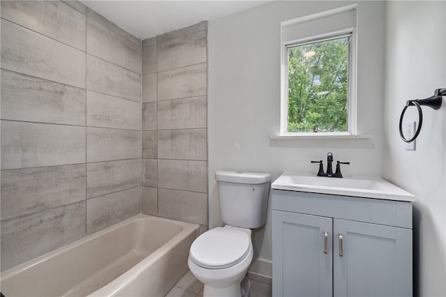 full bathroom with vanity, tiled shower / bath combo, and toilet