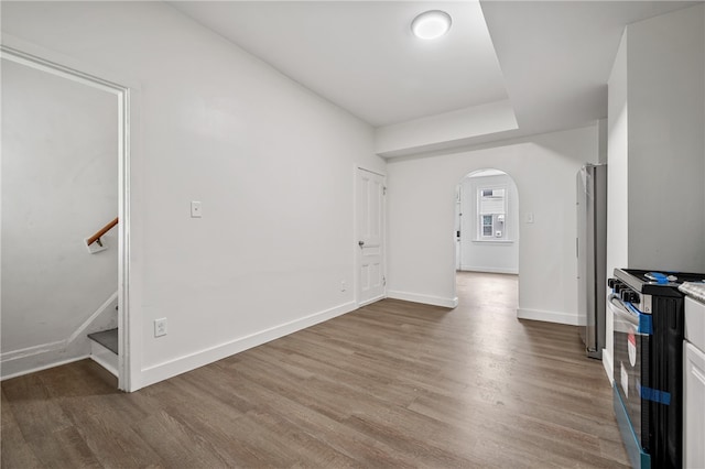 unfurnished living room with wood-type flooring