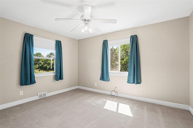 carpeted empty room with ceiling fan