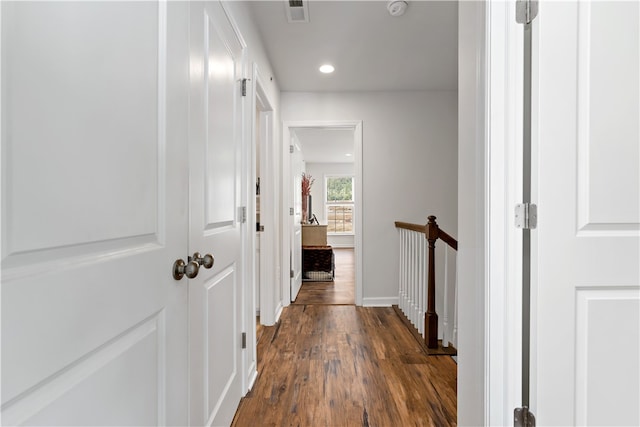 hall with dark wood-type flooring